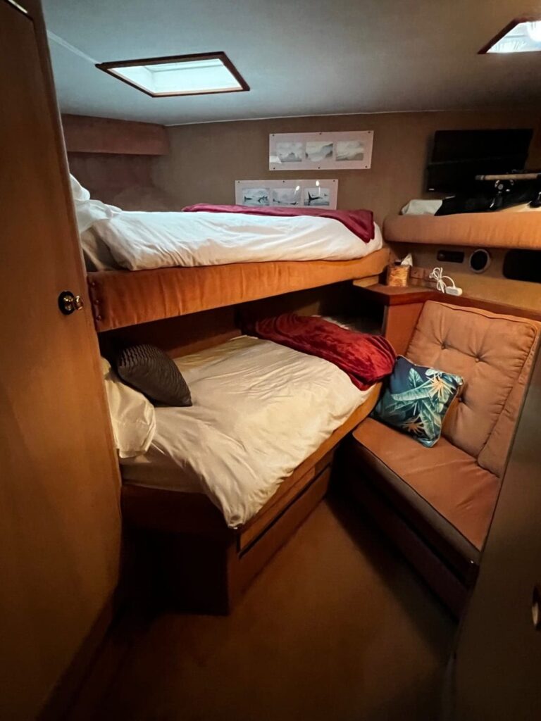 A bunk bed in the middle of a room.